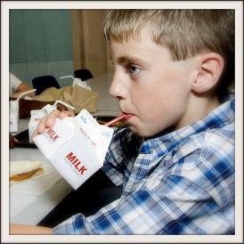 Image of a Student Drinking A Carton of Milk